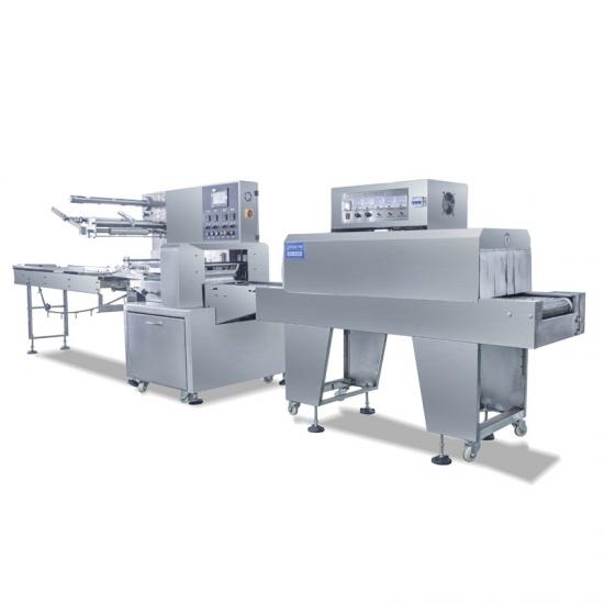 Heat shrinkable film packaging machine